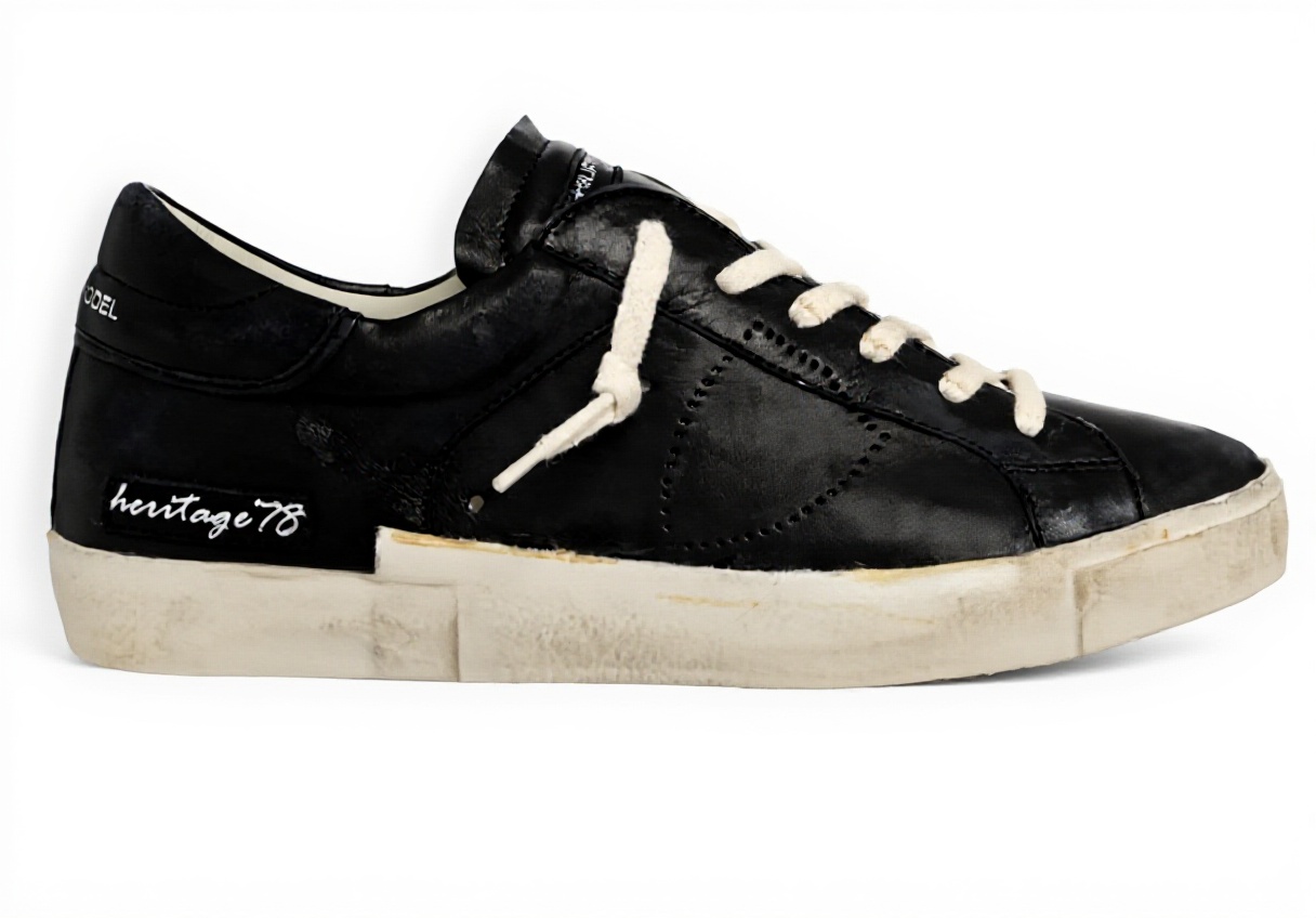 Philippe Model Herren Sneaker Vintage 78 in Schwarz auf grauem Hintergrund